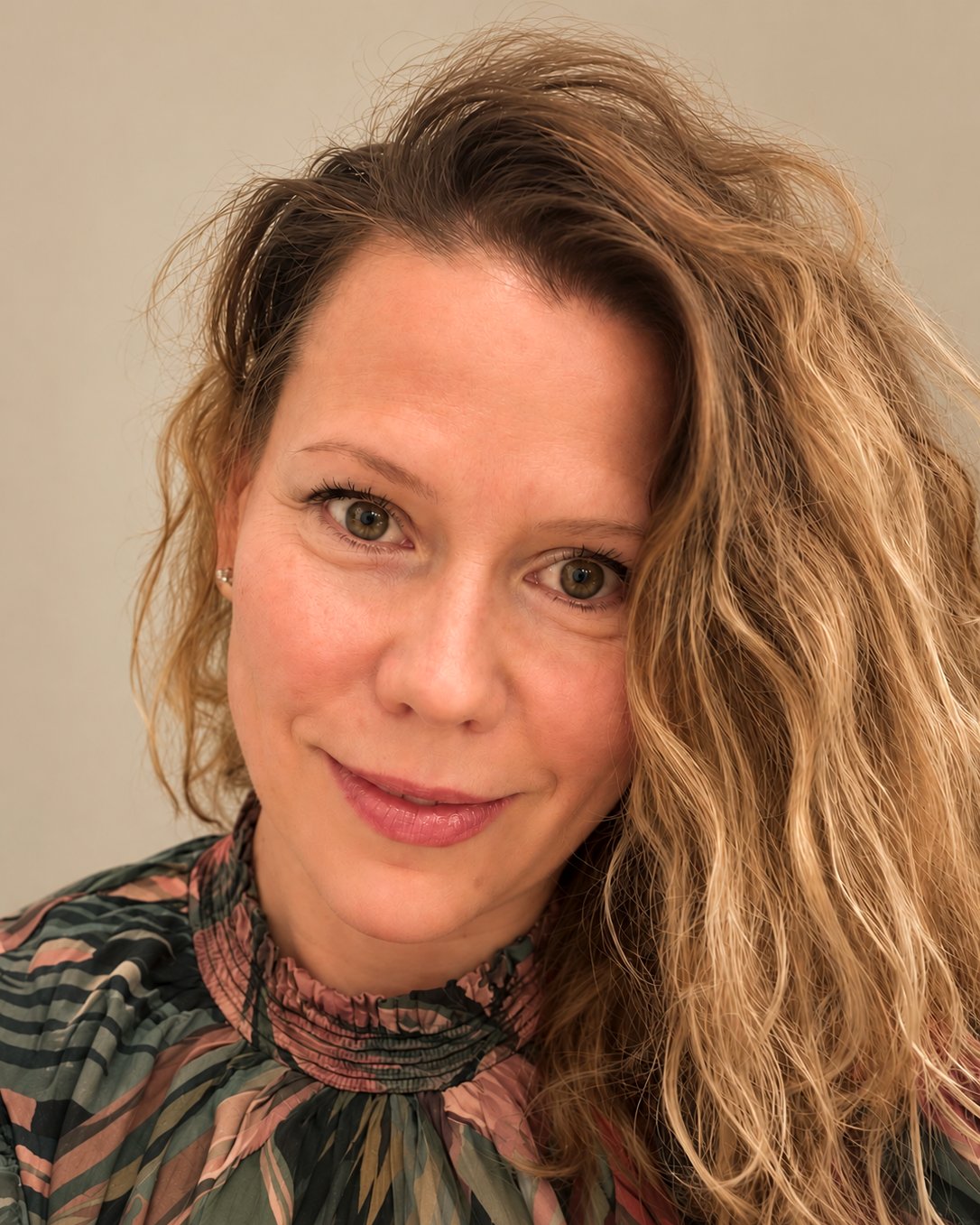 Olesya Van Dijck, looking directly at the camera